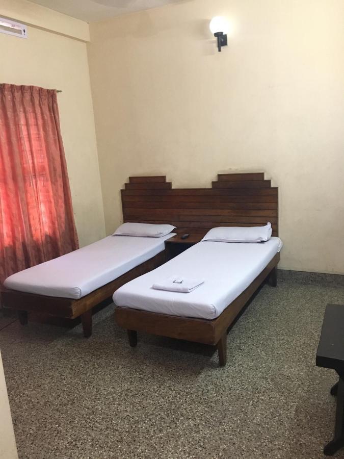 Nellimoottil Guest House Kottayam Oda fotoğraf